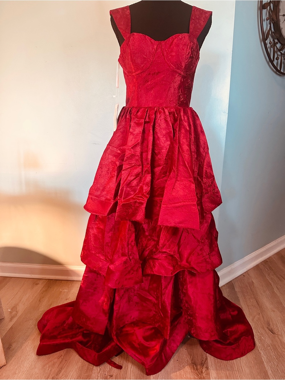 Elegant Red Tiered Prom Gown with Structured Bodice